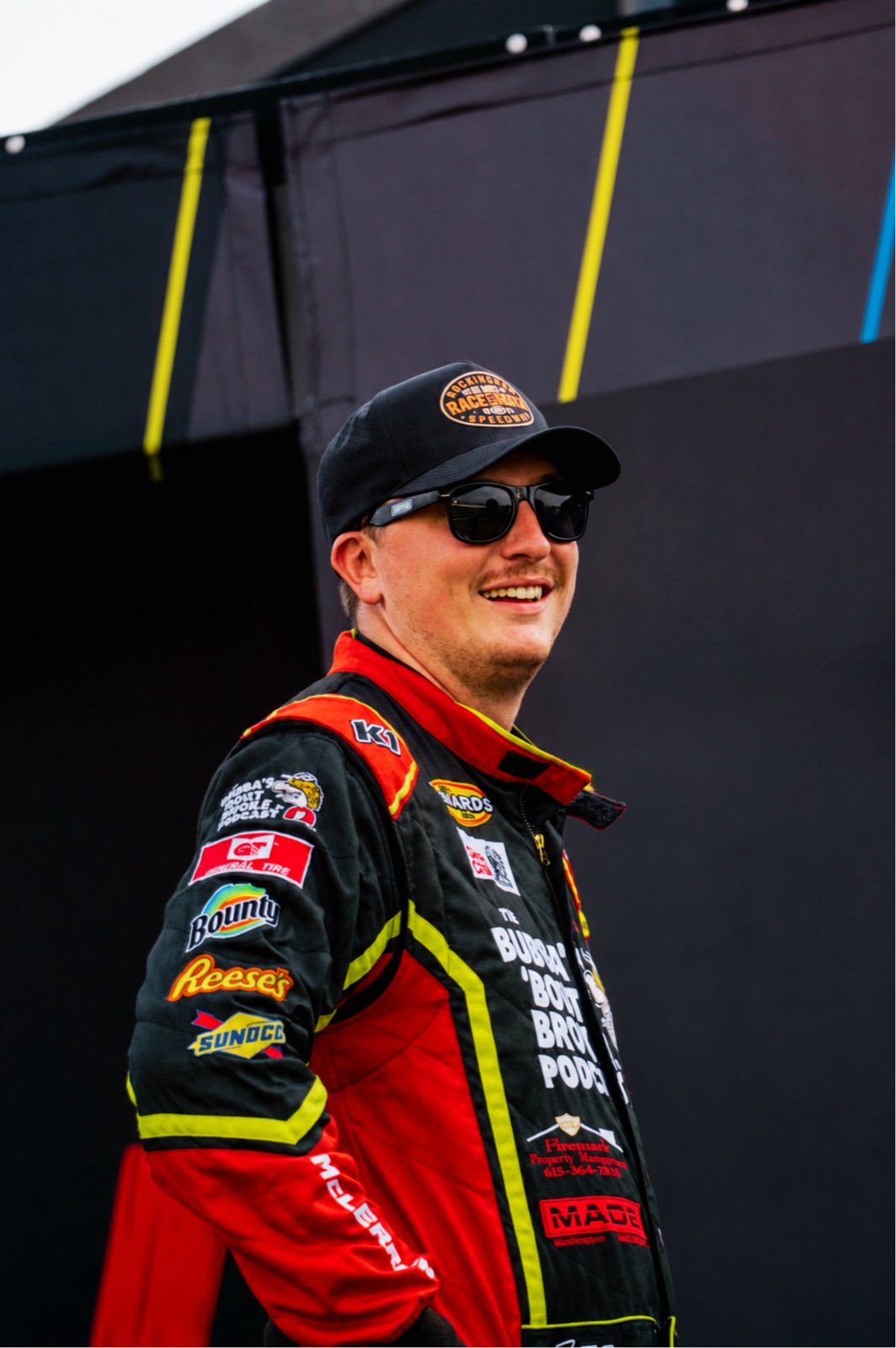 Jackson McLerran smiling in his racing suit at the track